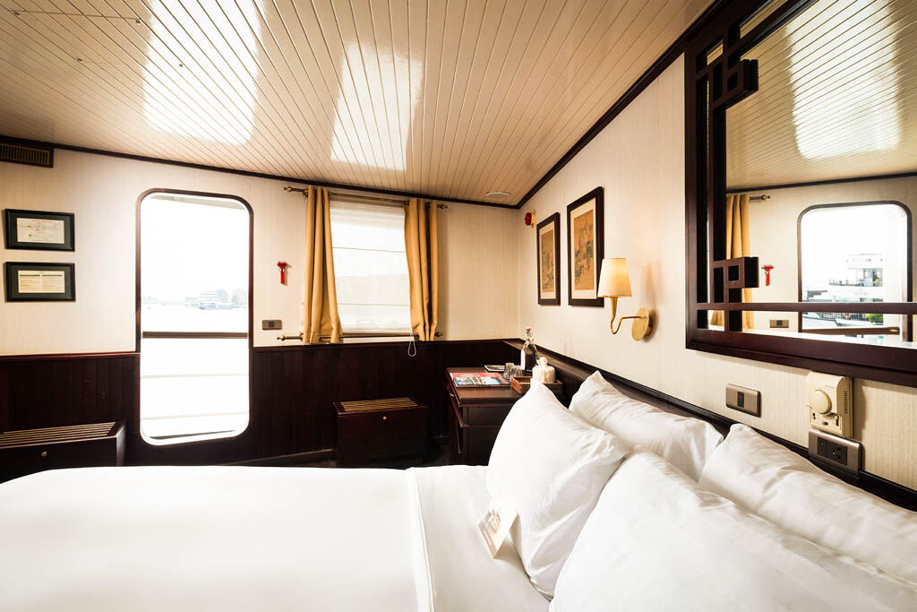 Feel the magic of Halong Bay from the comfort of your private cabin